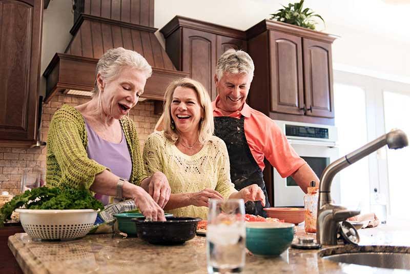 family cooking in kitchen